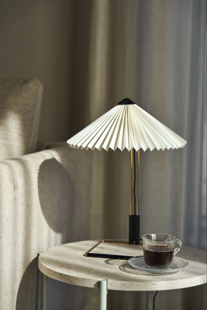 Plan your lighting in your home with three different types of lighting, here you see the pleated Matin lamp from HAY. 