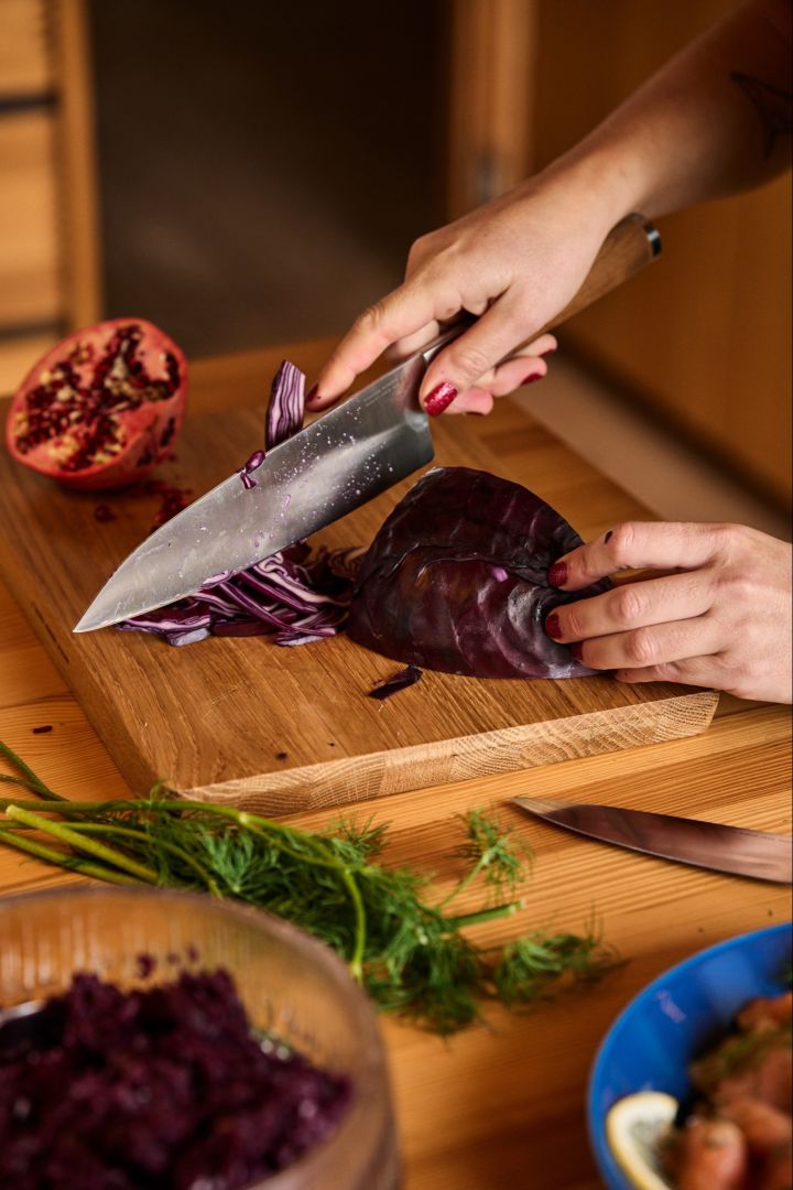 A cabbage is sliced with the Norden Chefs knife in preparation for a Christmas salad. 