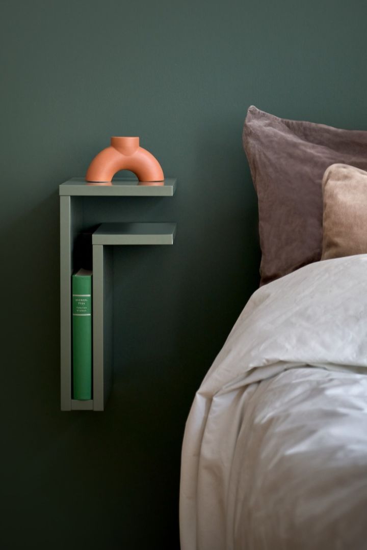 The F-shelf in green against a matching green wall. 
