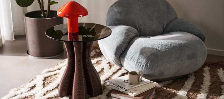 3D printed furniture is an environmentally friendly choice from Ekbacken Studios, here you see a living room with the anemone side table in the colour chocolate.