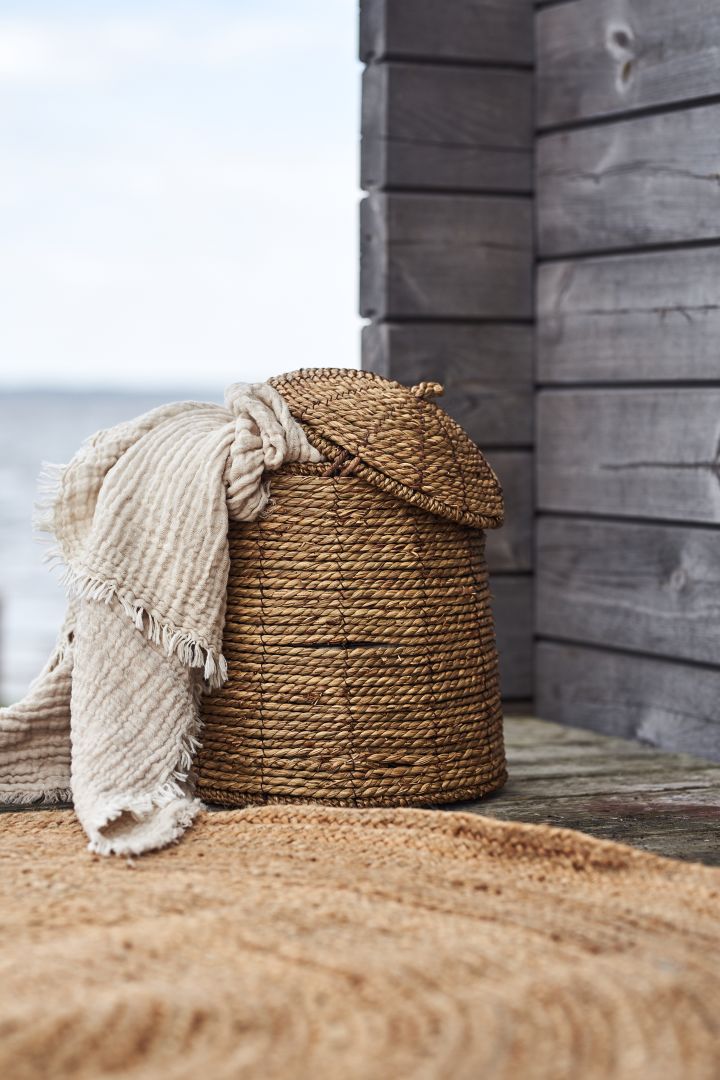 A summer essential from House Doctor, the Rama basket filled with cosy blankets.