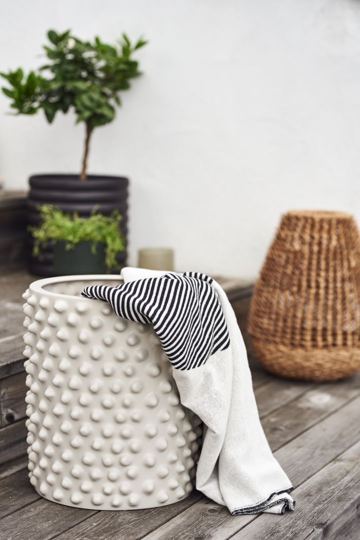 Plant pots are always a summer essential for the outside but have you thought about using them to store your pillows and throws? 