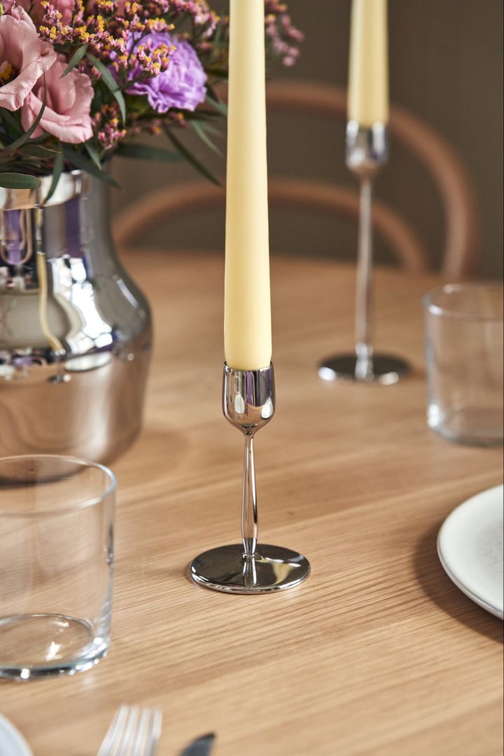 A close up of the Dorotea candle stick 12cm in polished stainless-steel for Gense. 