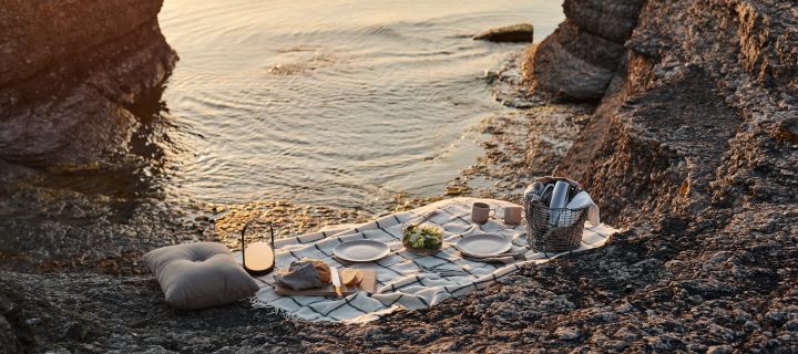 The cordless table lamp, Carrie from Audo Copenhagen is the perfect accompaniment to an atmospheric picnic on the beach.
