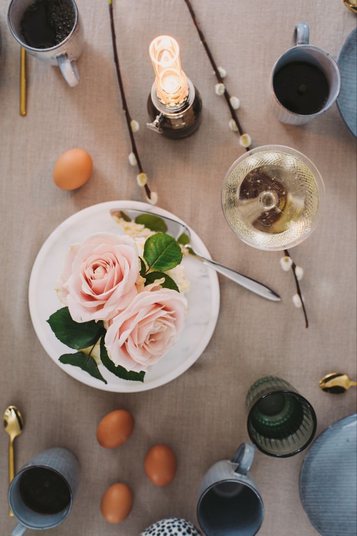 Willow twigs and chicken eggs are beautifully simple decorations for the Easter table setting.