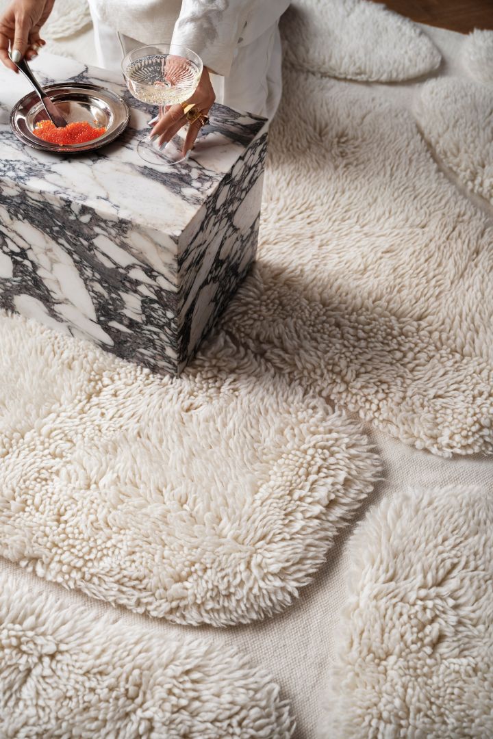 Here you see a fluffy white wool rug from Swedish design brand Tinted Objects. 