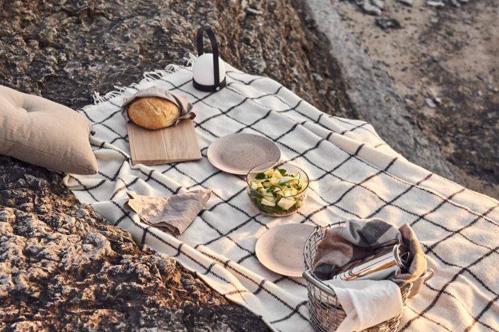 Enjoy a picnic on the beach at sunset with the carrie lamp from Audo Copenhagen.
