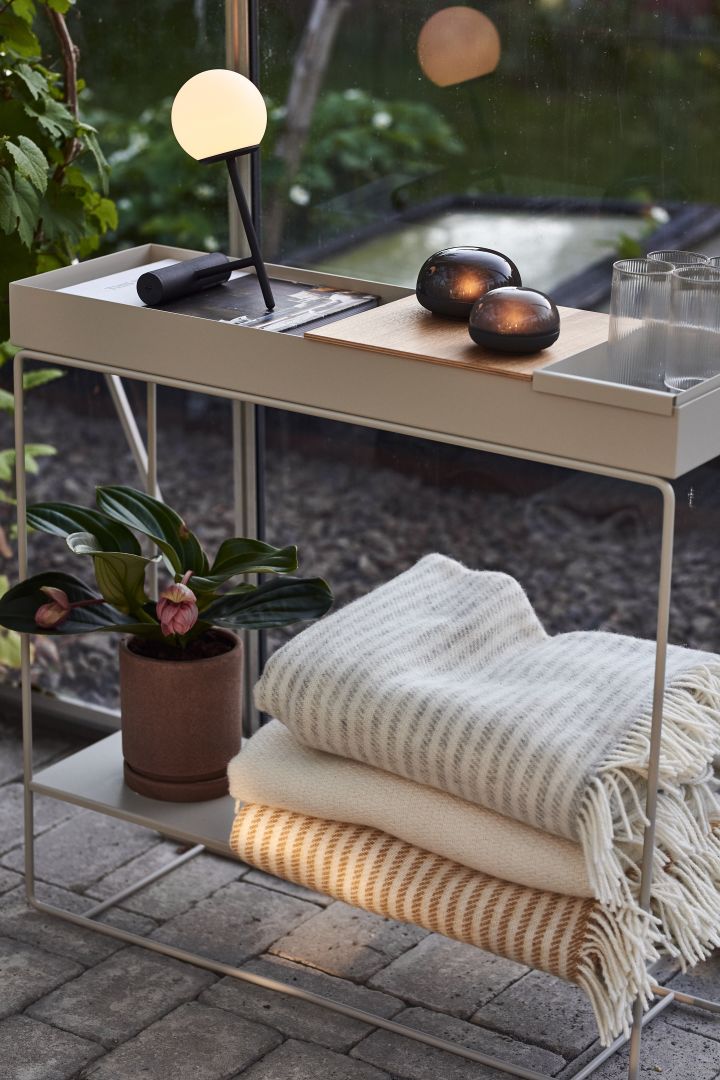 Cosy patio decor ideas - Create a cozy patio by decorating it with stylish and practical Plant Box from ferm LIVING for blankets, pots, lighting or for storage.