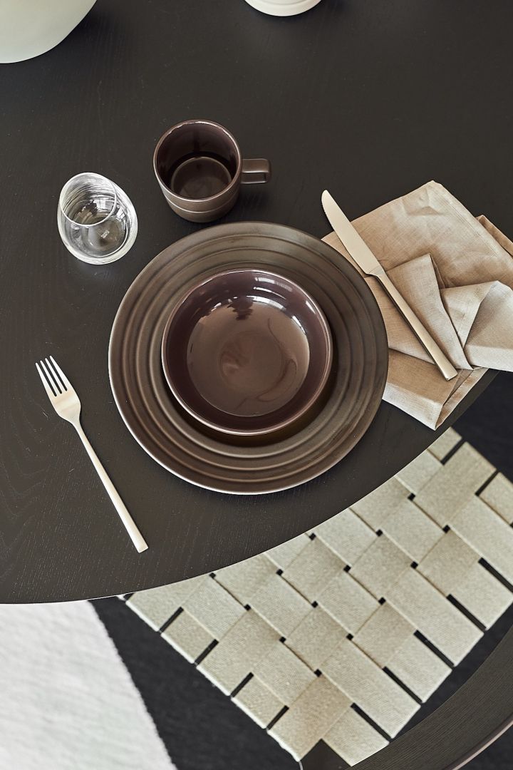 Lines porcelain in a brown shade from NJRD on a minimalistic table.